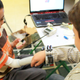 Can children play with other children while using their prosthetic arms? Dario plays with his best friend.